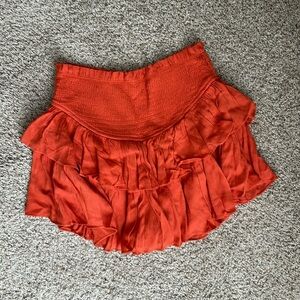 Cute burnt orange ruffle mini skirt/skort!